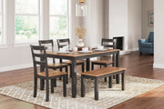 Ashley Furniture Gesthaven dining table with four chairs and bench, showcasing a stylish wood finish and sturdy construction.
