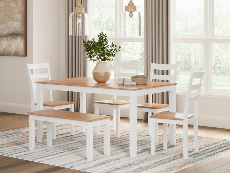 Ashley Furniture Gesthaven dining table with four matching chairs and a bench, perfect for family gatherings.