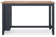 Ashley Furniture Gesthaven counter height dining table with a wood finish and sturdy legs, shown from a head-on angle.