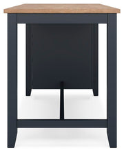 Ashley Furniture Gesthaven counter height dining table with a wooden surface and sturdy legs, shown from a side angle.