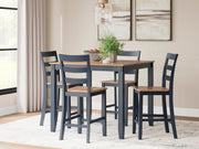 Ashley Furniture Gesthaven counter height dining table with four matching barstools, featuring a warm wood finish and sturdy design.