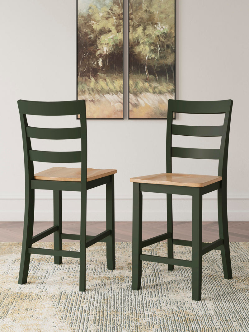 Ashley Furniture Gesthaven counter height barstool with wooden legs and cushioned seat, shown in a natural wood finish.