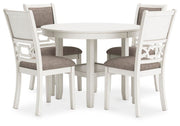 Ashley Furniture Erinberg dining table with four matching chairs, modern wood finish and angled design, set for family meals.