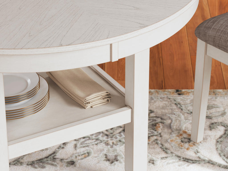 Ashley Furniture Erinberg dining table with four matching chairs, showcasing a modern wood finish and sleek design in a dining room setting.