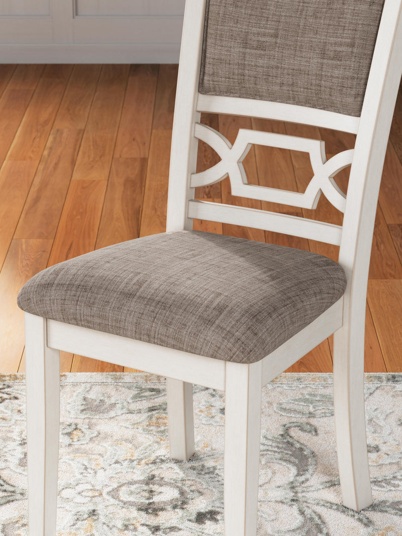 Ashley Furniture Erinberg dining table with four chairs and a bench, showcasing a modern wood dining set.