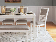 Ashley Furniture Erinberg dining table with four chairs and a matching bench, wood finish and contemporary style.