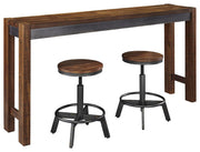 Ashley Furniture Torjin counter height dining set with four chairs and a rectangular table in a modern dining room setting.