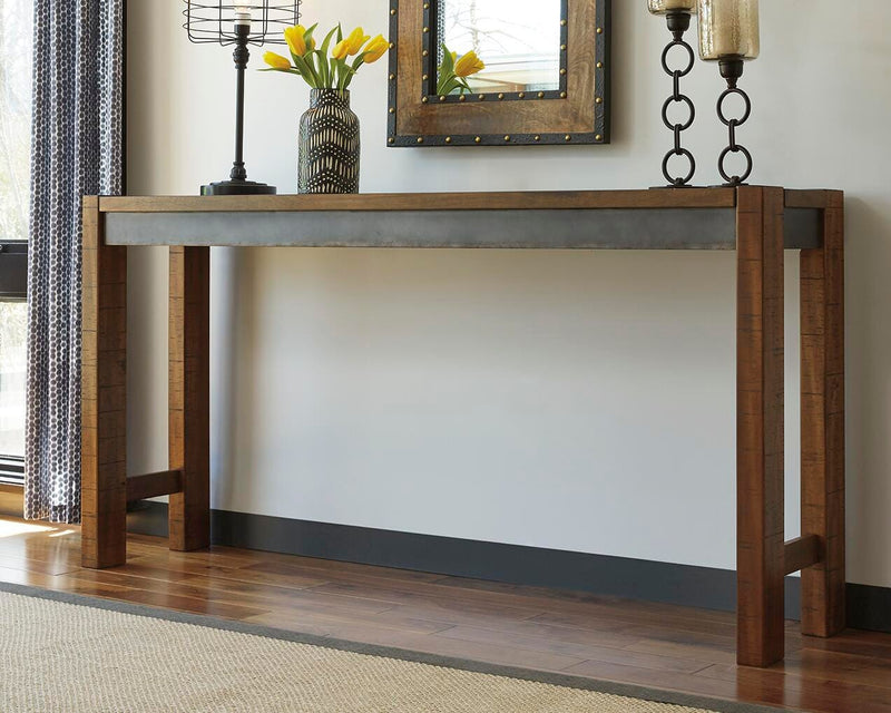 Ashley Furniture Torjin counter height dining set with four chairs and a rectangular table in a modern dining room setting.