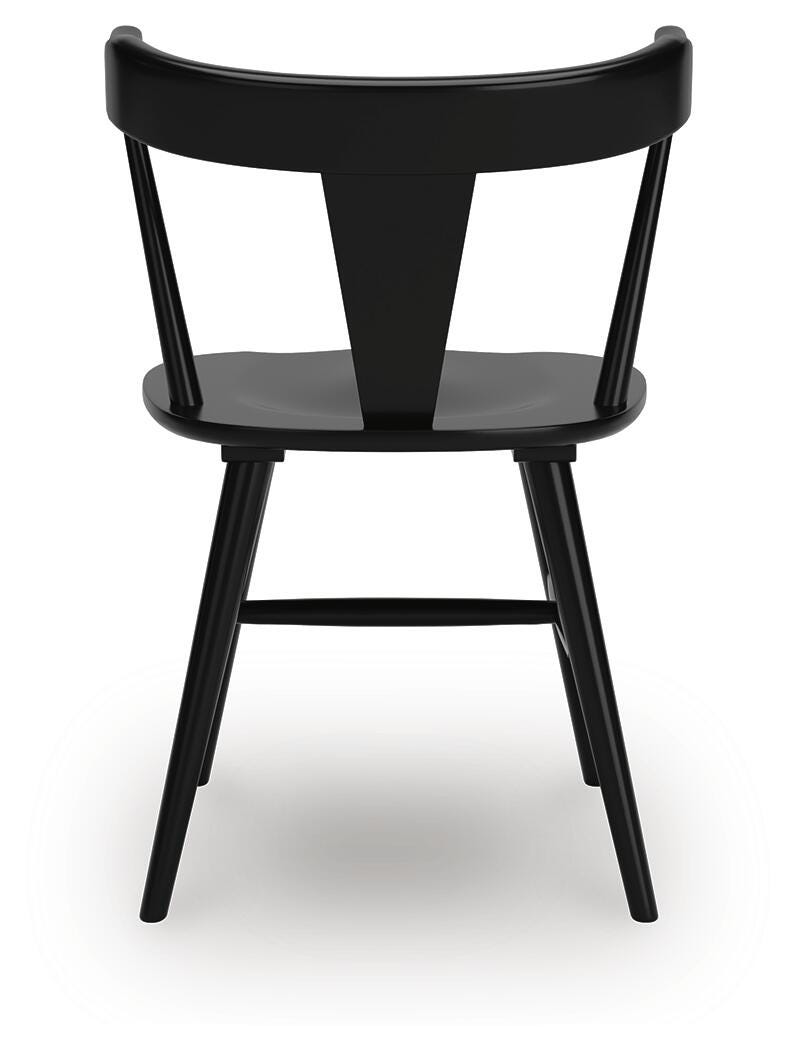 Ashley Furniture Gretlynn dining room set with a wooden table and matching chairs, shown from the back perspective.