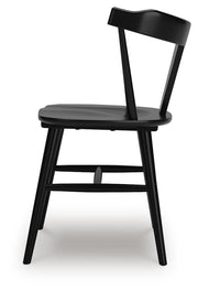 Ashley Furniture Gretlynn dining room set with a side view of the table and chairs in a modern dining area.