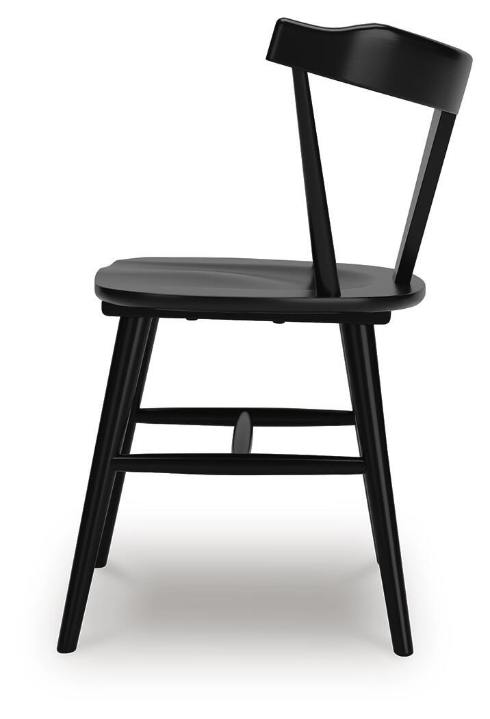 Ashley Furniture Gretlynn dining room set with a side view of the table and chairs in a modern dining area.
