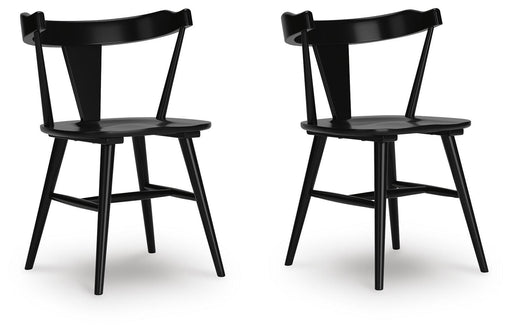 Ashley Furniture Gretlynn dining chair with upholstered seat and wooden legs, shown from an angled side view.