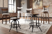 Ashley Furniture Valebeck counter height bar stool with wooden legs and upholstered seat, shown from a side angle.