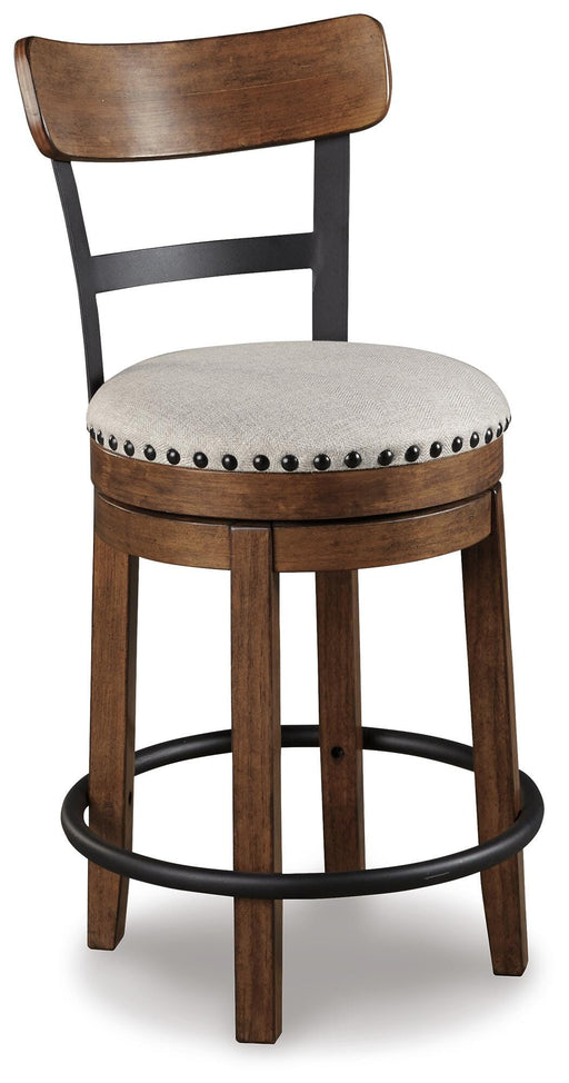 Ashley Furniture Valebeck counter height bar stool with wooden legs and cushioned seat, shown from an angled side view.