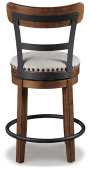 Ashley Furniture Valebeck counter height bar stool with wooden frame and cushioned seat, shown from the back.