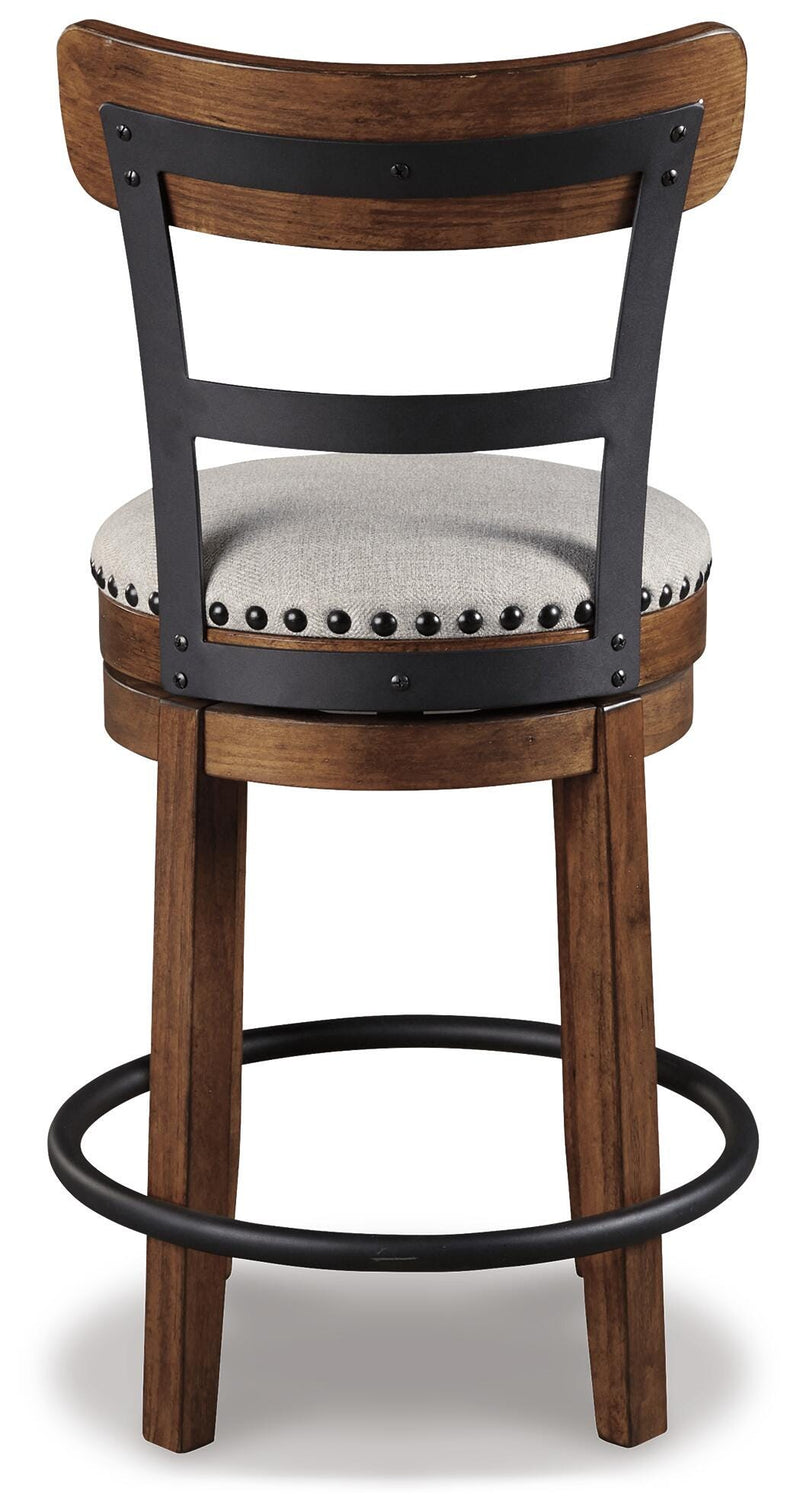 Ashley Furniture Valebeck counter height bar stool with wooden frame and cushioned seat, shown from the back.