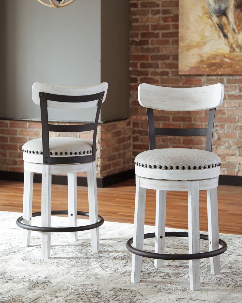 Ashley Furniture Valebeck counter height bar stool with wooden legs and upholstered seat, shown from a side angle.