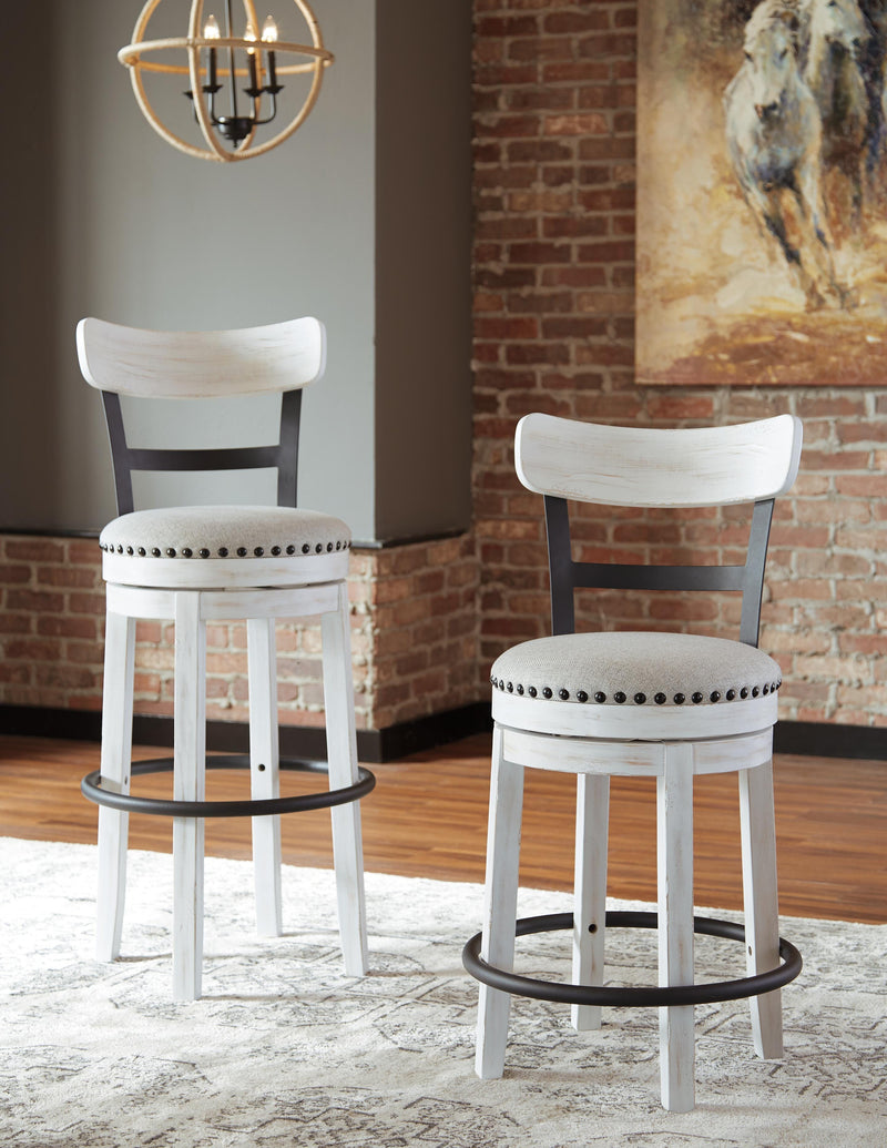 Ashley Furniture Valebeck counter height bar stool with wooden legs and cushioned seat, shown from a side angle.