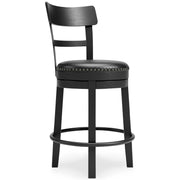 Ashley Furniture Valebeck counter height bar stool with wooden legs and a cushioned seat, shown from an angled view.