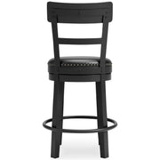 Ashley Furniture Valebeck counter height barstool with cushioned seat and wooden legs, shown from the back.