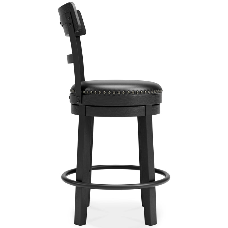 Ashley Furniture Valebeck counter height bar stool with wooden legs and a cushioned seat, shown from a side angle.