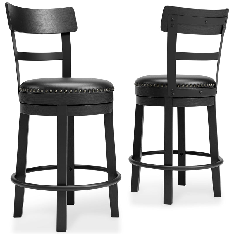Ashley Furniture Valebeck counter height bar stool with wooden legs and cushioned seat, shown from side angle.