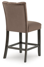 Ashley Furniture Jeshina counter height barstool with padded seat and backrest, featuring a sleek wooden frame and modern design.