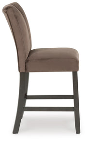 Ashley Furniture Jeshina counter height barstool with wood legs and upholstered seat, shown from a side angle.