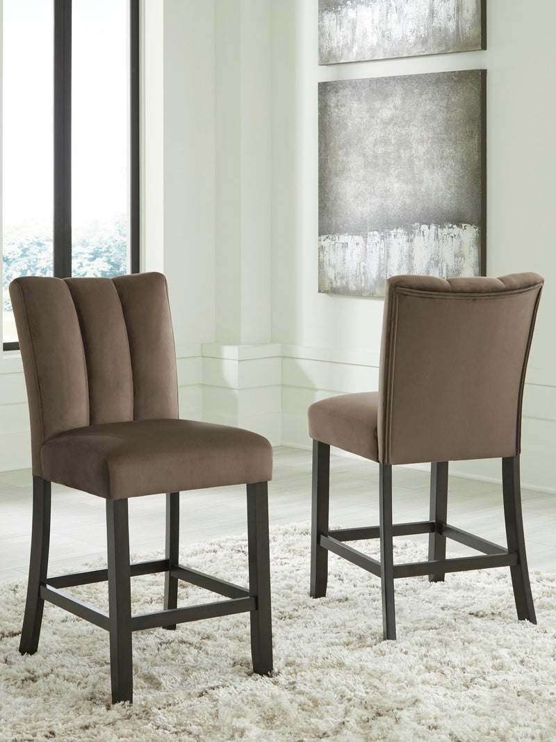 Jeshina counter height barstool by Ashley Furniture with a wooden seat and metal frame, shown from a side angle.