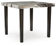 Ashley Furniture Jeshina counter height dining table with a wooden finish, shown from an angled side view.