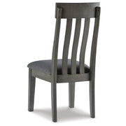 Back view of the Ashley Furniture Hallanden Dining Room Set, showcasing the wooden table and matching chairs.