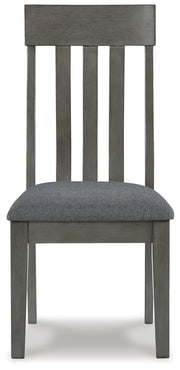 Ashley Furniture Hallanden dining room set with a wooden table and matching chairs, shown from a head-on angle.