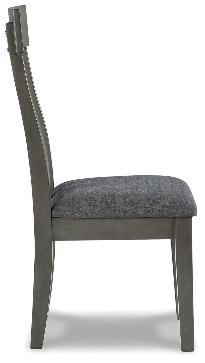 Ashley Furniture Hallanden Dining Room Set with a wooden table and six matching chairs in a modern dining space.