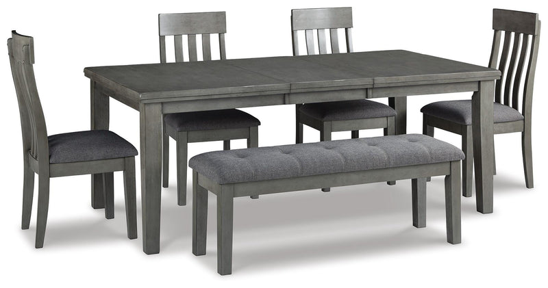 Ashley Furniture Hallanden dining room set with a wooden table and six matching chairs in a modern dining space.