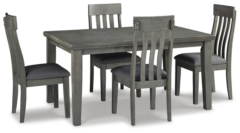 Ashley Furniture Hallanden dining room set with a wooden table and matching chairs, shown in a modern dining space.
