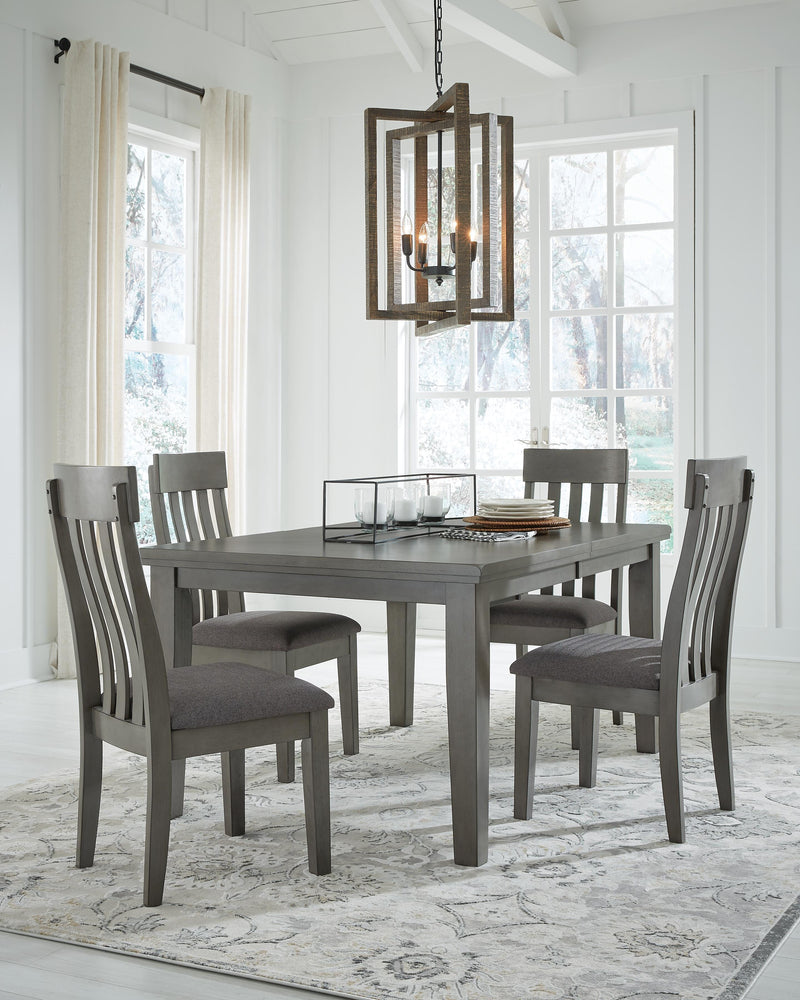 Ashley Furniture Hallanden dining room set with a table and four chairs, featuring a modern wood finish and sleek design.