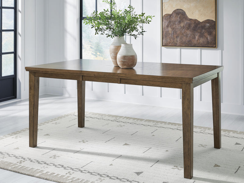 Ashley Furniture Urbinforte dining room set with a wooden table and six matching chairs in a modern dining space.