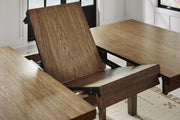 Ashley Furniture Urbinforte dining room set with a leaf-shaped table and matching chairs, detailed wood finish and elegant design.