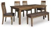 Ashley Furniture Urbinforte dining room set with a wooden table and matching chairs in a modern design.