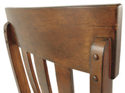 Ashley Furniture Ralene Dining Chair Set featuring upholstered seats and wooden legs, shown in a close-up detail image.