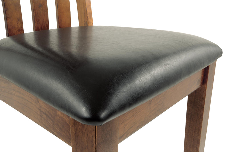 Ashley Furniture Ralene Dining Chair Set with upholstered seats and wooden legs, shown in a detailed close-up image.
