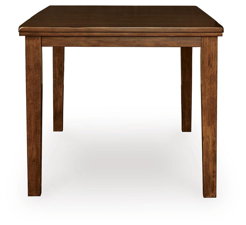 Ashley Furniture Ralene counter height dining extension table with a wooden surface and sturdy legs, shown from the side.
