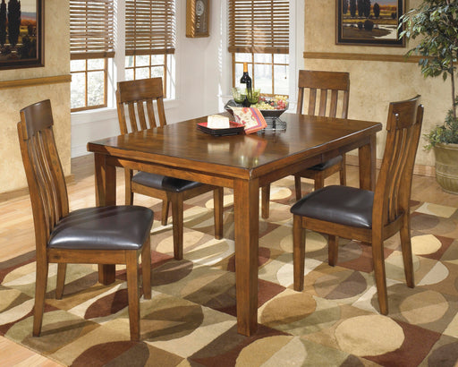 Ashley Furniture Ralene dining room set with a wooden table and matching chairs, ideal for modern dining spaces.