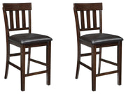 Ashley Furniture Haddigan barstool set with four modern wooden stools featuring cushioned seats and sleek design.