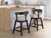 Set of two Ashley Furniture Haddigan counter height barstools with wooden seats and metal legs, ideal for kitchen or bar area.