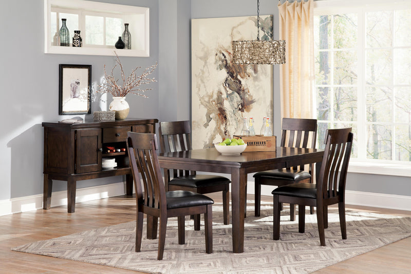 Ashley Furniture Haddigan dining set with a wooden table and six matching chairs in a modern dining room.