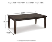 Ashley Furniture Haddigan dining set with a wooden table and matching chairs in a modern dining room setting.