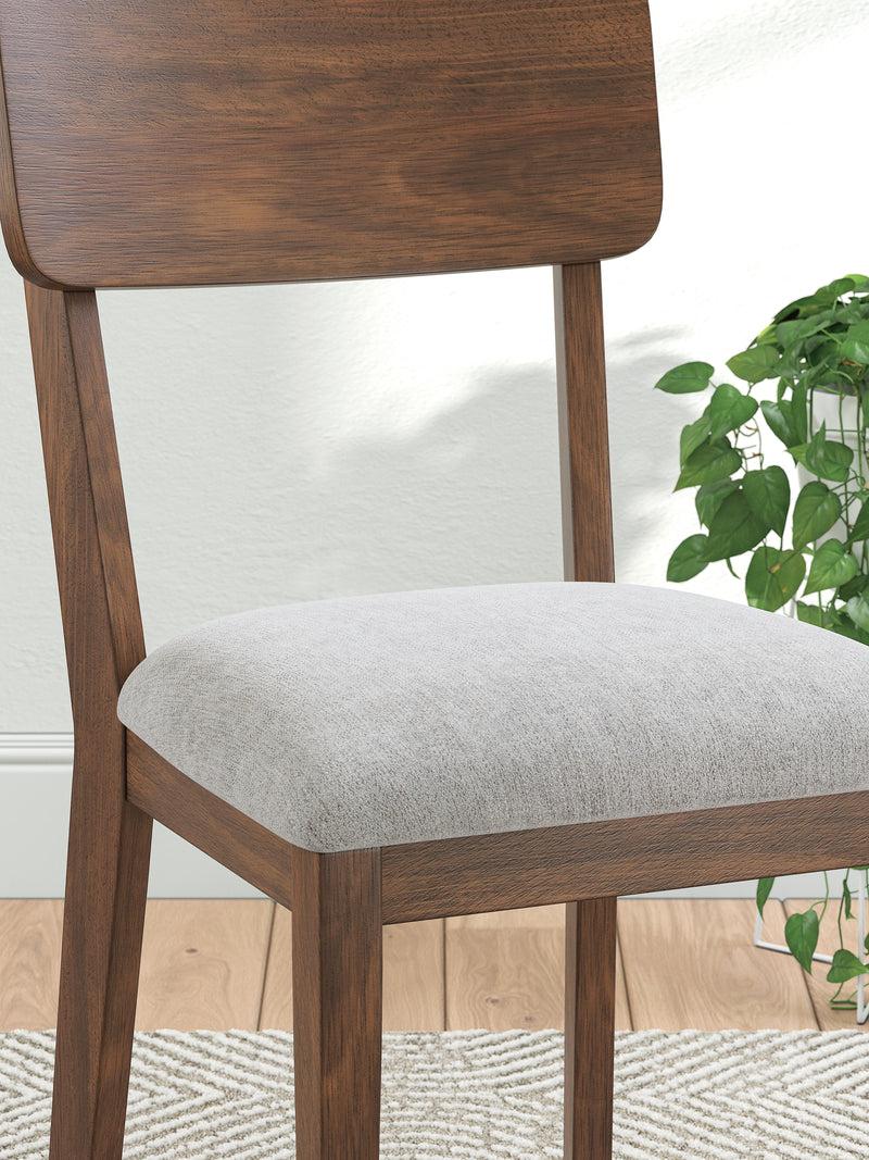 Ashley Furniture Tameride dining chair with upholstered seat and wooden legs, showcasing a modern and comfortable design.