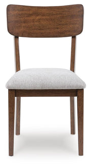 Ashley Furniture Tameride dining table with four matching chairs, showcasing a modern wood finish and clean design.