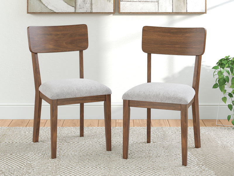 Ashley Furniture Tameride dining chair with upholstered seat and wooden frame, featuring a classic design for dining rooms.